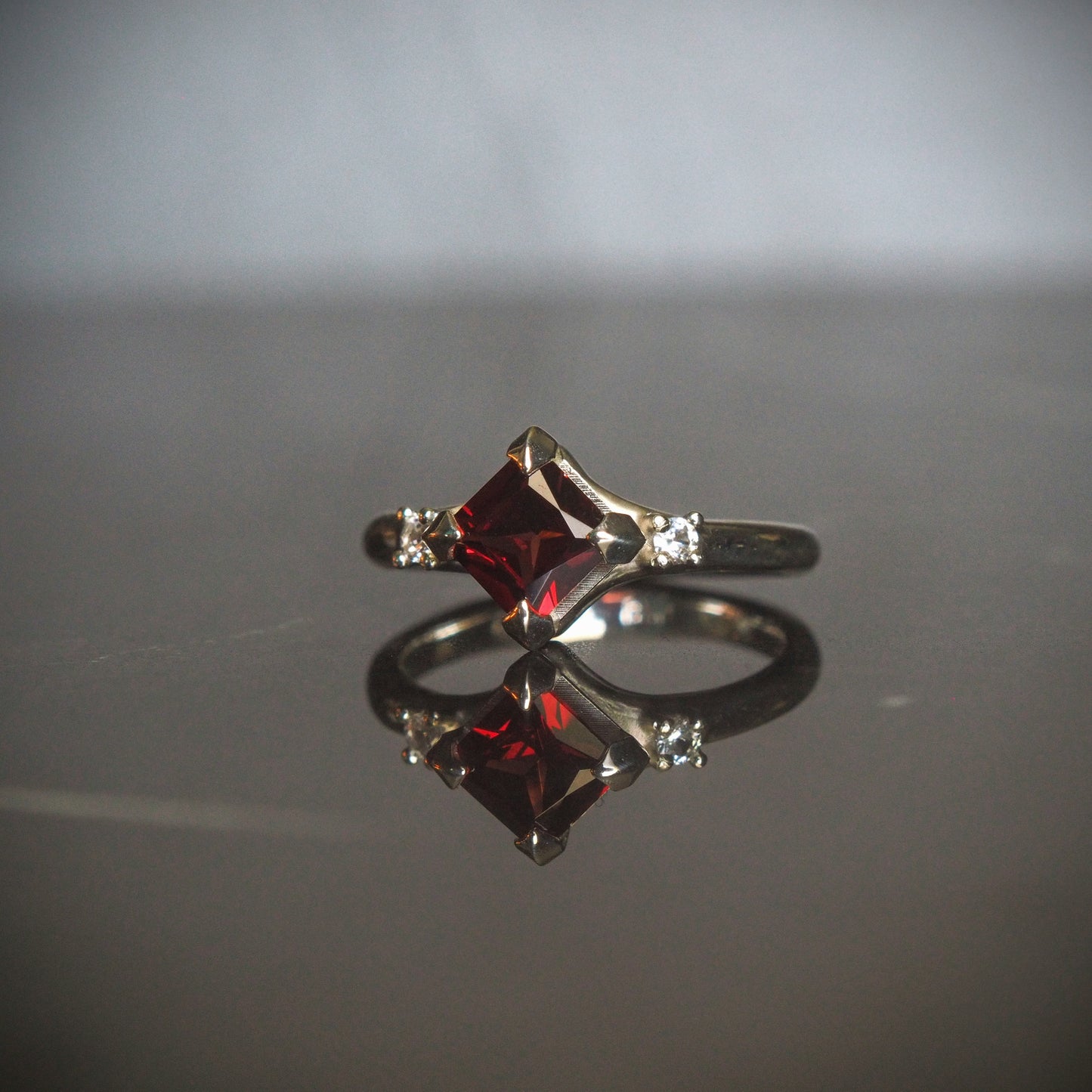 Princess Garnet ring with White Sapphires